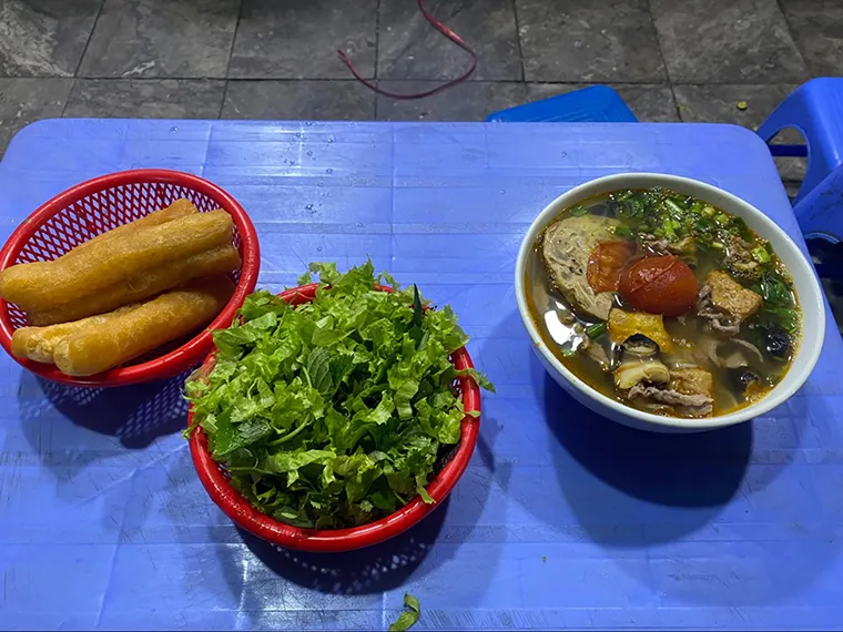 Co Loc's Hang Khoai stall is famous late night food Hanoi